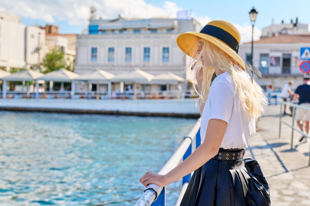 young-teenage-female-in-hat-on-city-sea-